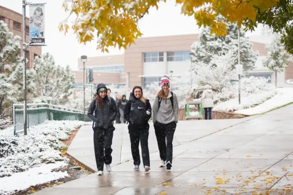 Students walk on a wintery campus