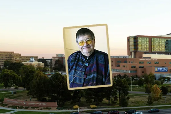 A profile picture of Bonnie W. Camp MD in front of a photo of the CU Anschutz medical campus